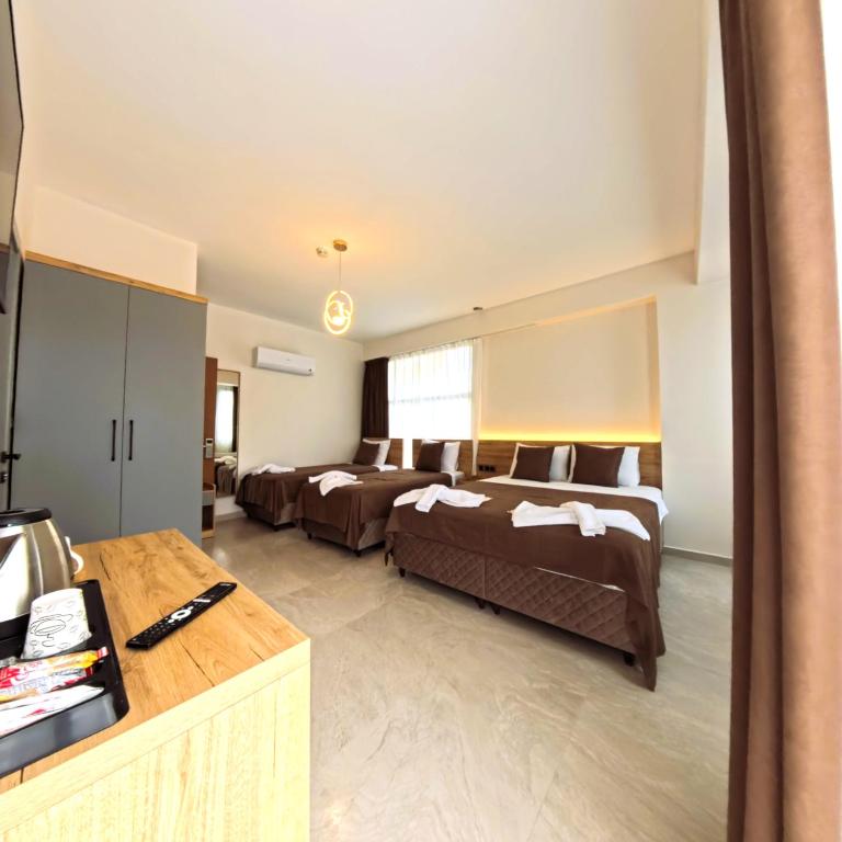 Postel nebo postele na pokoji v ubytování Naturalis Pamukkale Otel