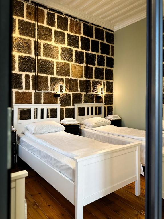 Postel nebo postele na pokoji v ubytování Tiroents Hotel