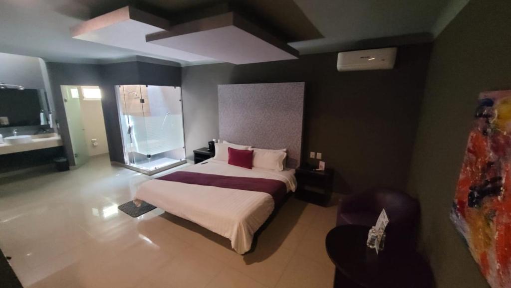 Postel nebo postele na pokoji v ubytování Motel Real de Queretaro
