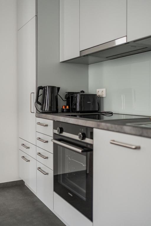 Kuchyň nebo kuchyňský kout v ubytování HOME1 - Josefstadt Apartments