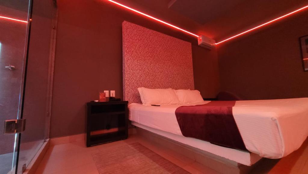 Postel nebo postele na pokoji v ubytování Motel Real de Queretaro