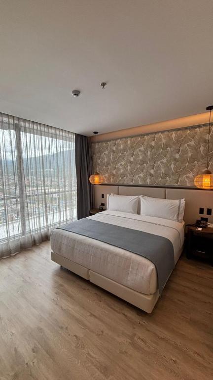 Postel nebo postele na pokoji v ubytování Sonesta Hotel Ibagué