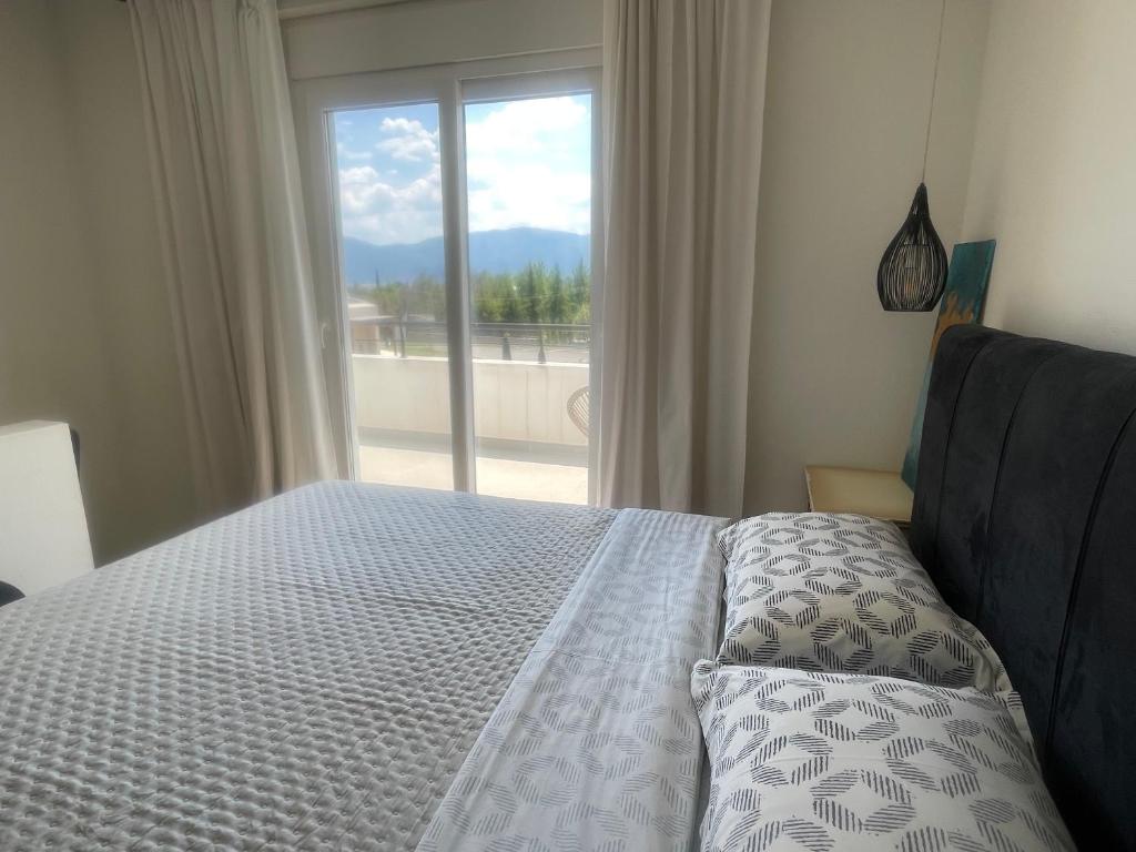 Postel nebo postele na pokoji v ubytování Terra holiday homes- Olivia