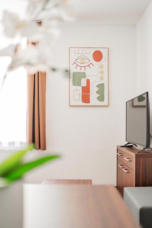 TV a/nebo společenská místnost v ubytování HOME1 - Josefstadt Apartments