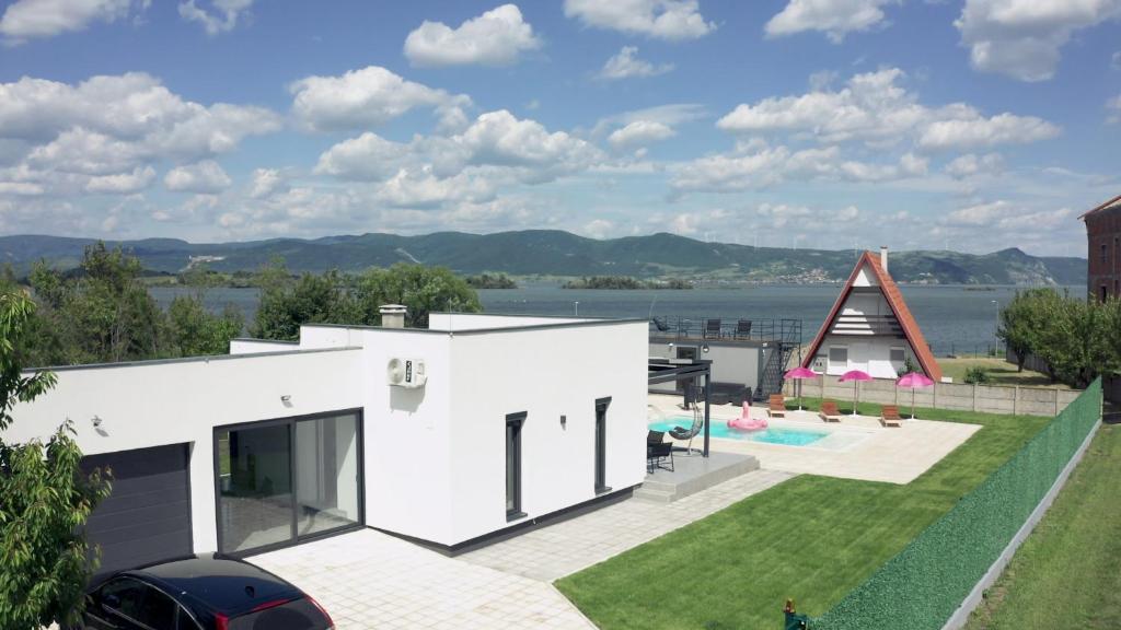 a house with a view of the water at Danka Pool House in Usije