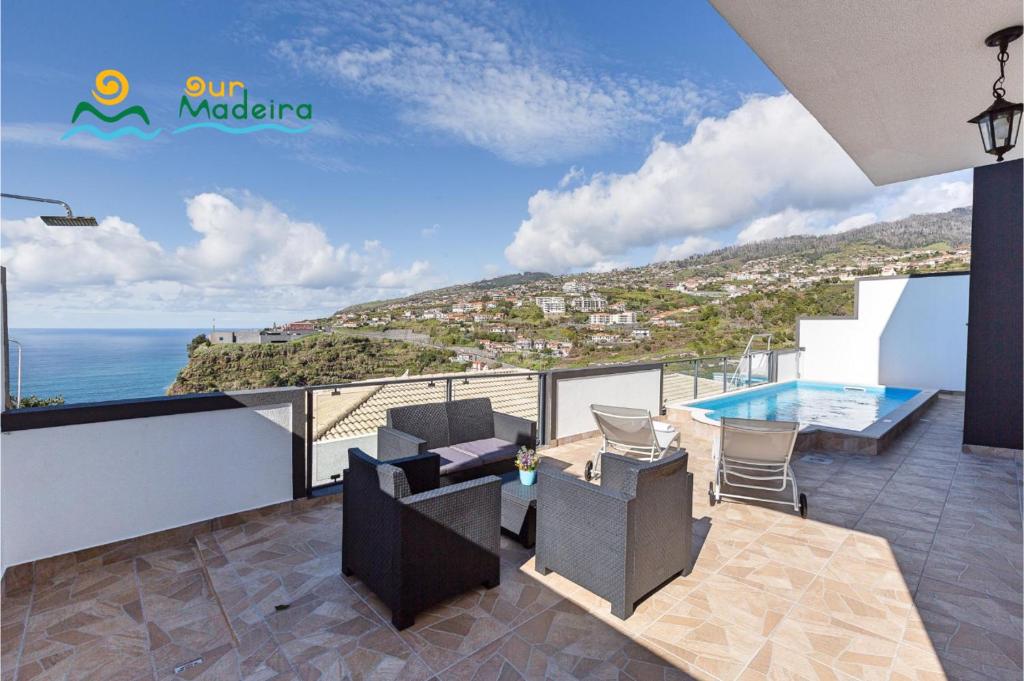 a balcony with a view of the ocean at OurMadeira - Casa da Belita, sea-view in Calheta