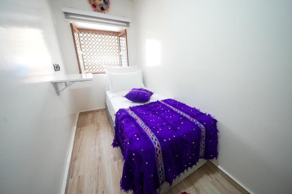Postel nebo postele na pokoji v ubytování Dar Al Fanouss