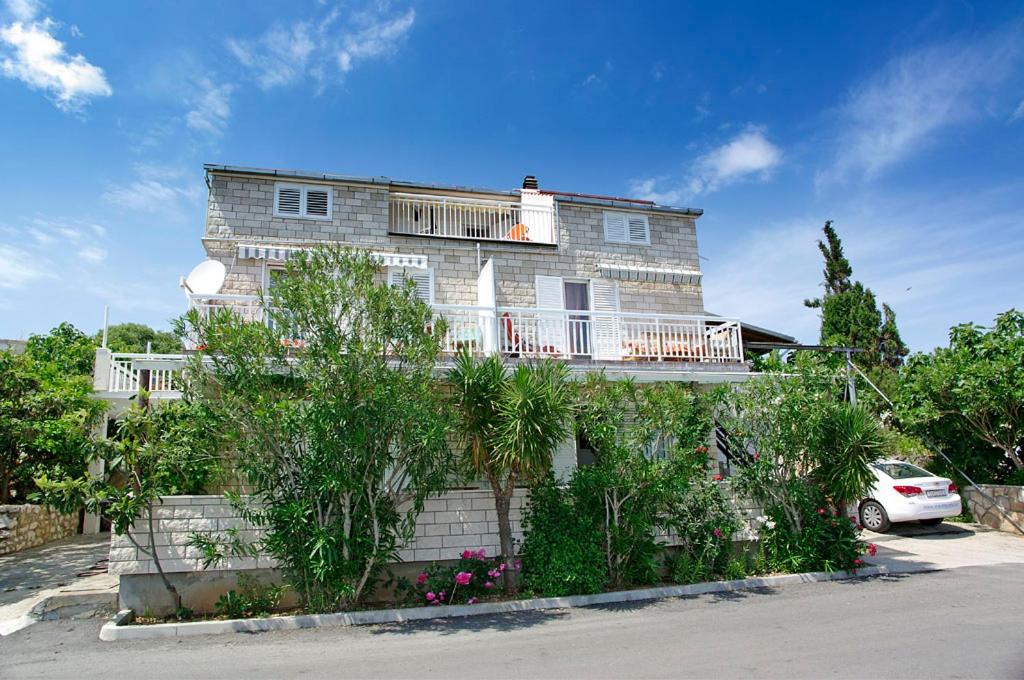 a large house with a car parked in front of it at Foissner Apartments in Zavalatica