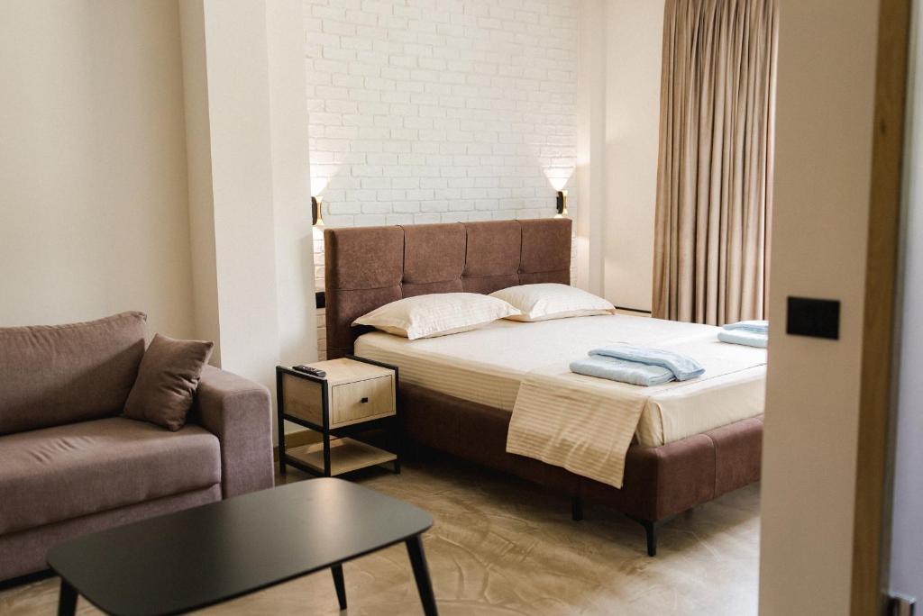 Postel nebo postele na pokoji v ubytování Ritson Hotel
