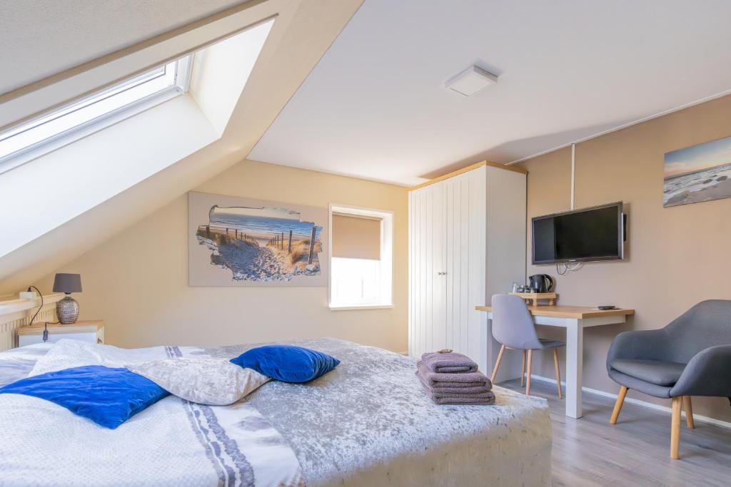 Postel nebo postele na pokoji v ubytování B&B Plompetorenzicht