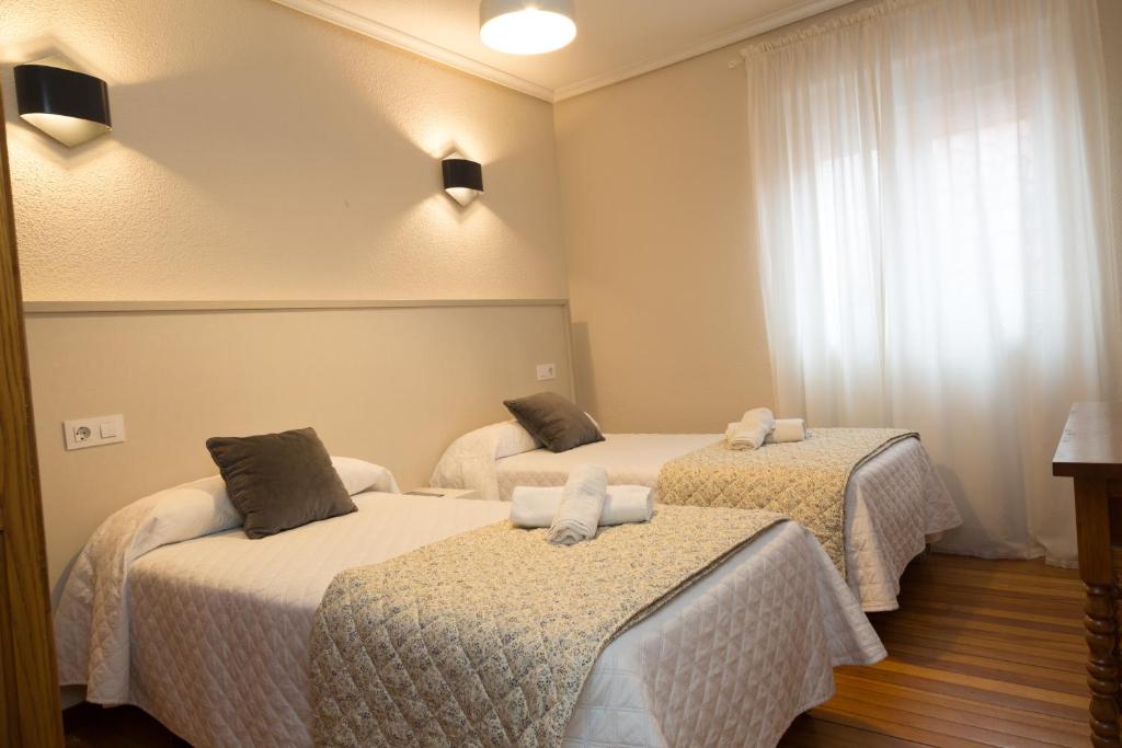 Cama o camas de una habitación en Hostería El Cruce
