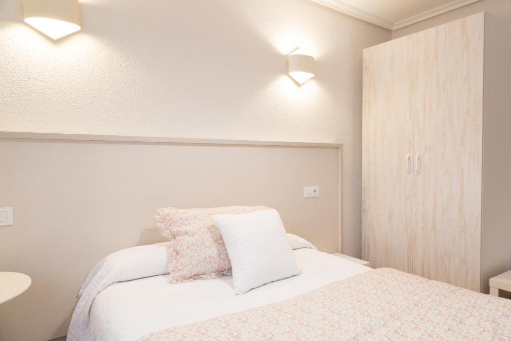 Cama o camas de una habitación en Hostería El Cruce