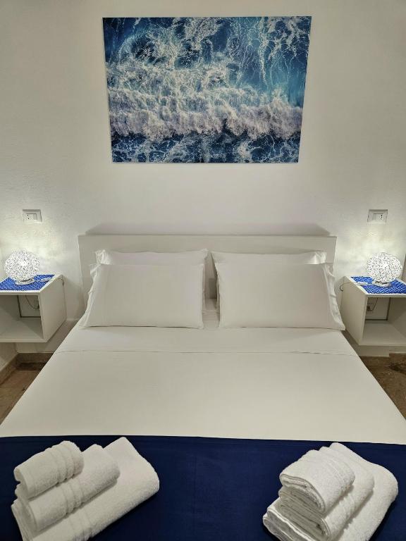 Postel nebo postele na pokoji v ubytování Albatros B&B Porto Cesareo
