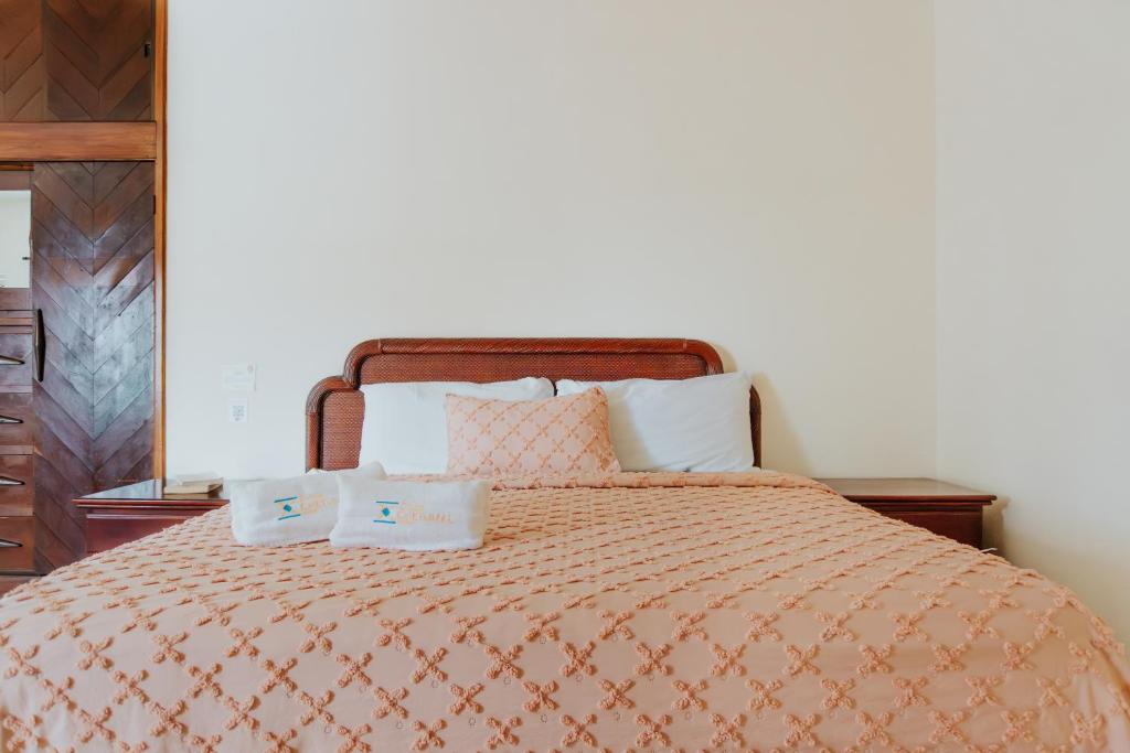 Postel nebo postele na pokoji v ubytování Casa Chetumal Hotel