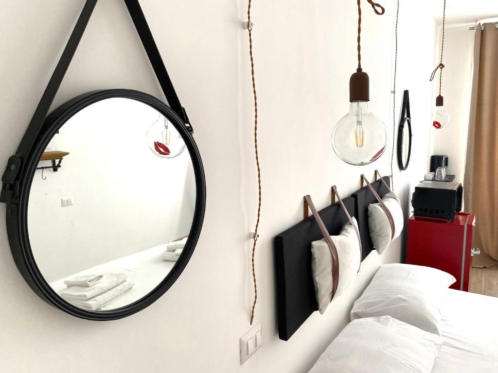 Postel nebo postele na pokoji v ubytování Isid'Oro Rooms