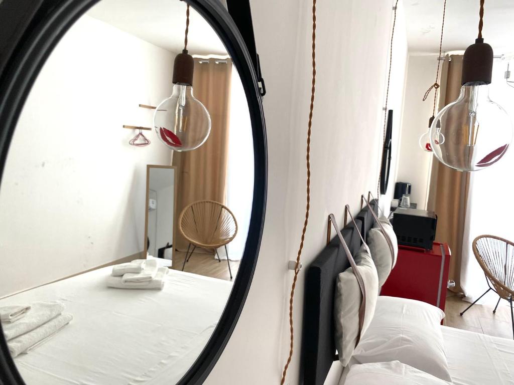 Postel nebo postele na pokoji v ubytování Isid'Oro Rooms