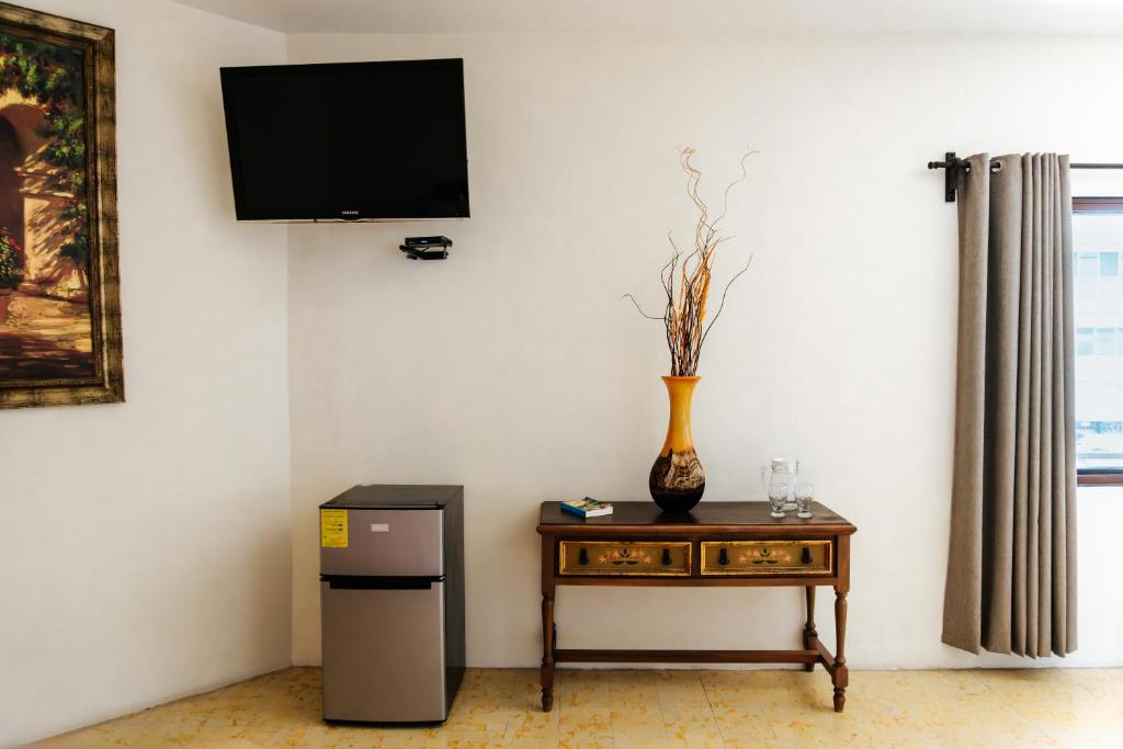 TV a/nebo společenská místnost v ubytování Casa Chetumal Hotel