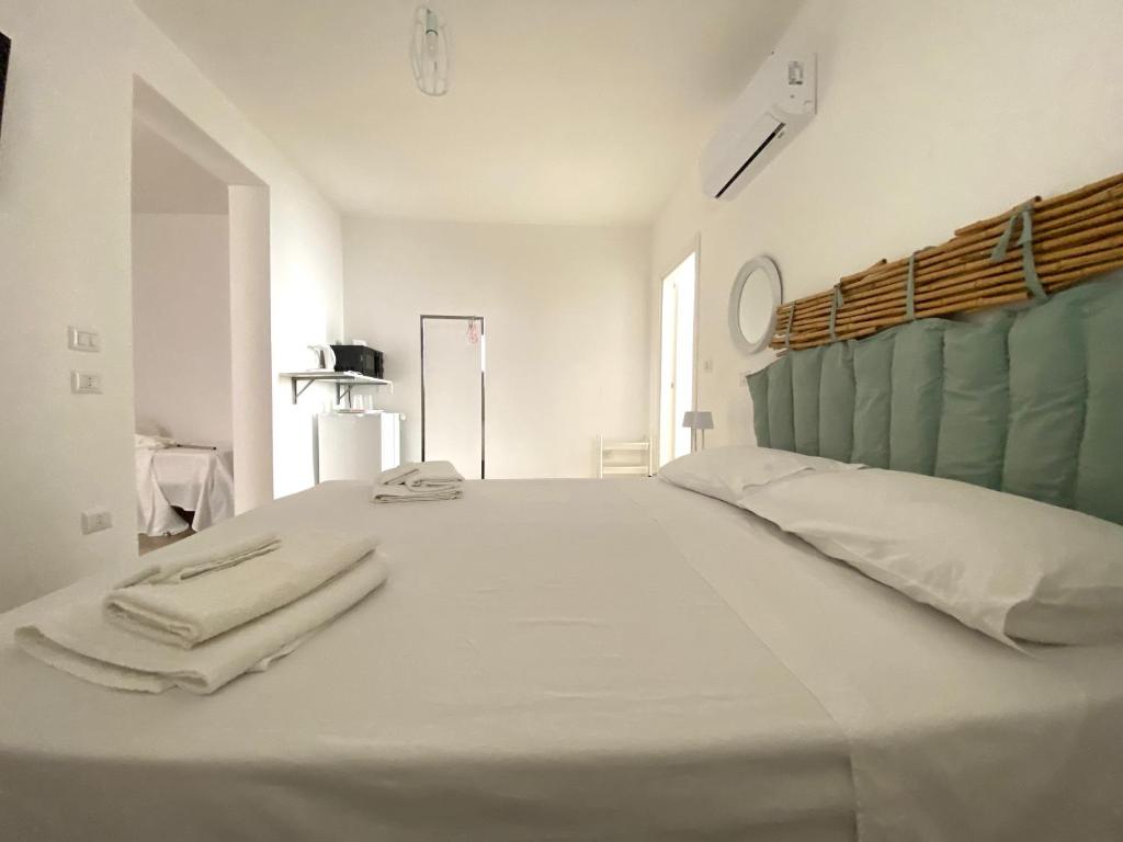 Postel nebo postele na pokoji v ubytování Isid'Oro Rooms