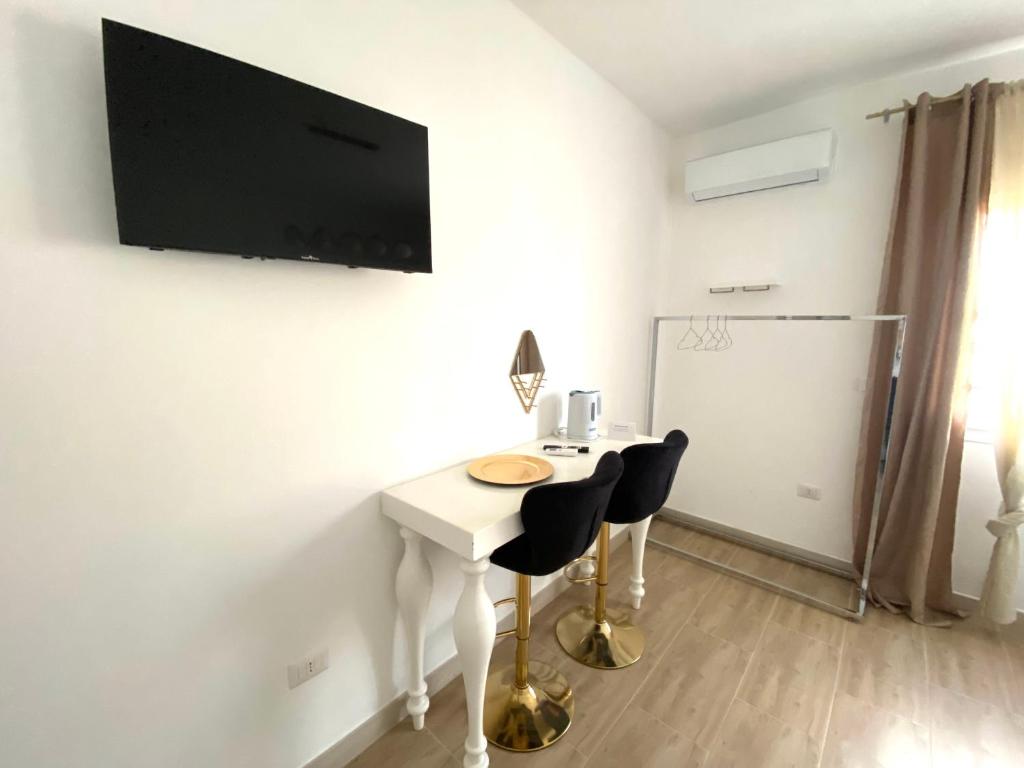 TV a/nebo společenská místnost v ubytování Isid'Oro Rooms