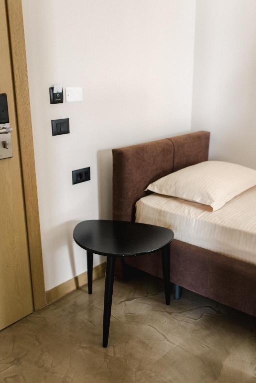 Postel nebo postele na pokoji v ubytování Ritson Hotel