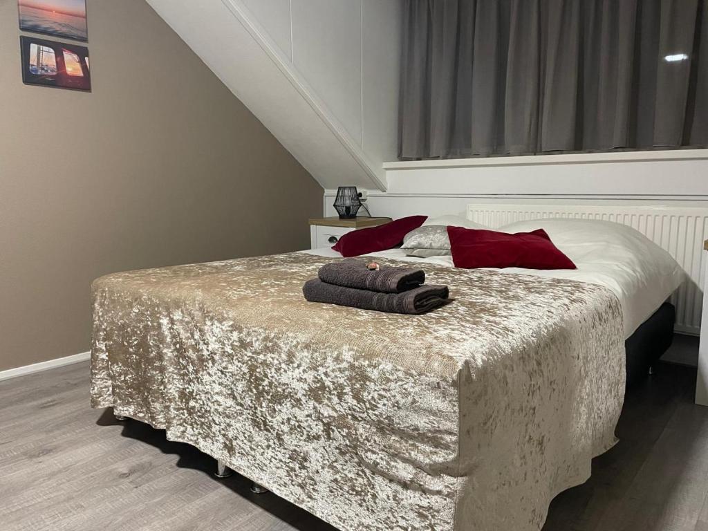 Postel nebo postele na pokoji v ubytování B&B Plompetorenzicht