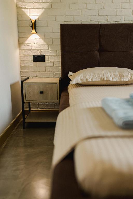 Postel nebo postele na pokoji v ubytování Ritson Hotel