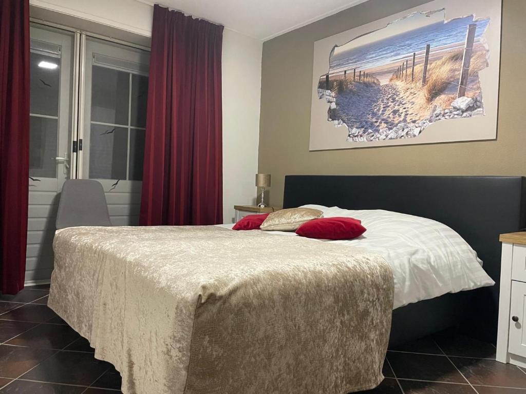 Postel nebo postele na pokoji v ubytování B&B Plompetorenzicht