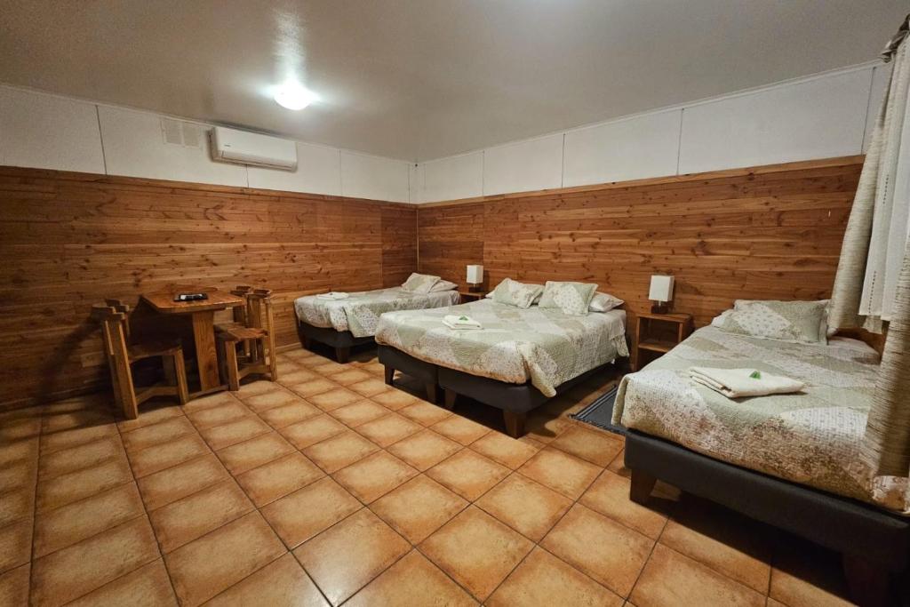 Postel nebo postele na pokoji v ubytování Apart Hotel Antu de Villarrica