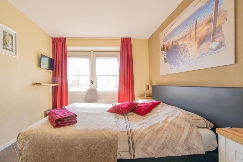 Postel nebo postele na pokoji v ubytování B&B Plompetorenzicht