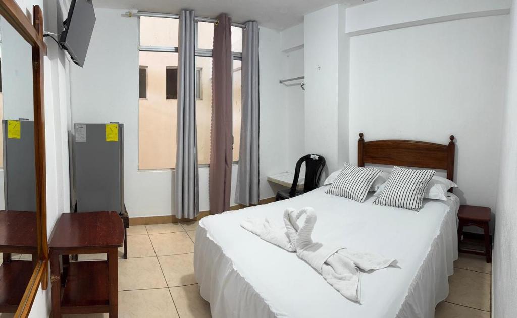 Postel nebo postele na pokoji v ubytování HOTEL PAL-MAR