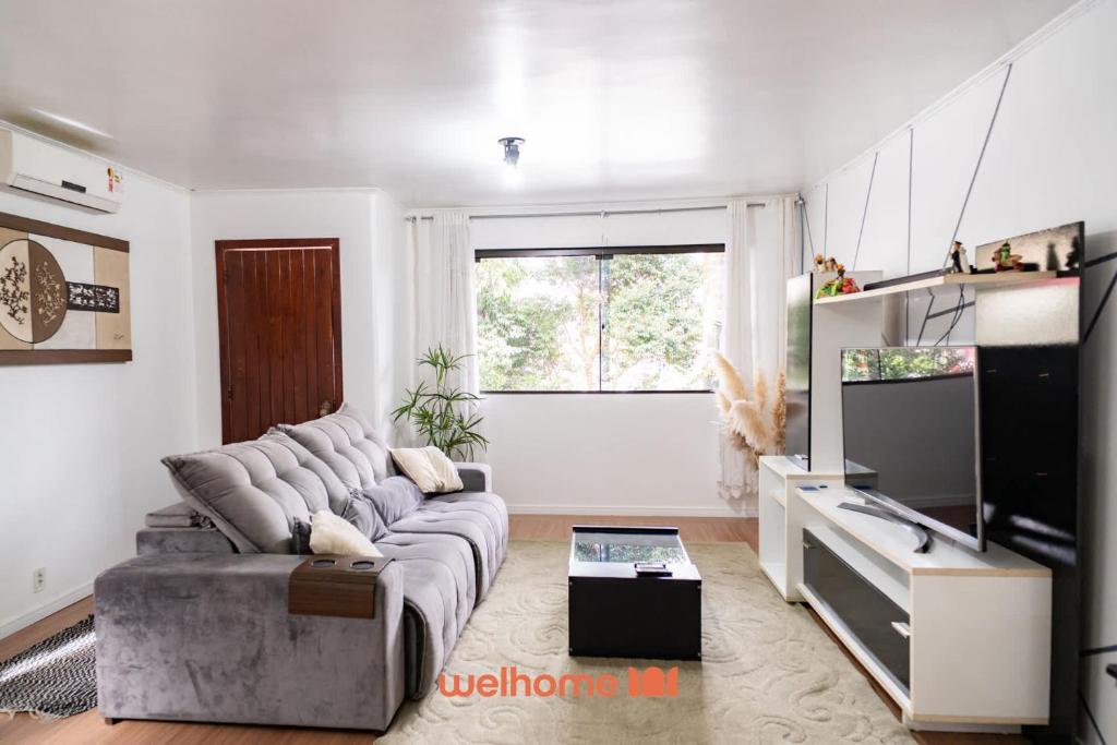 Et tv og/eller underholdning på Casa em Passo Fundo com Churrasqueira