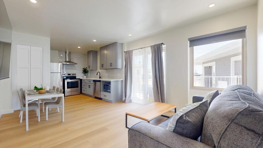 a living room with a couch and a table at Ocean's Edge Luxury Rentals in Ocean City