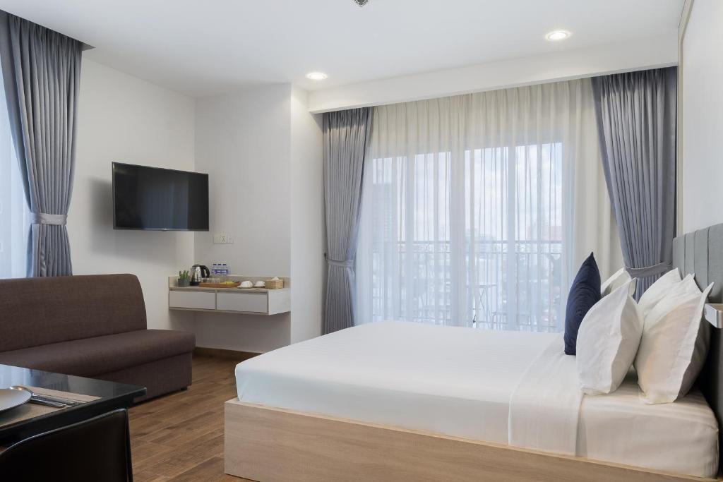 TV a/nebo společenská místnost v ubytování Amana Hotel & Residences