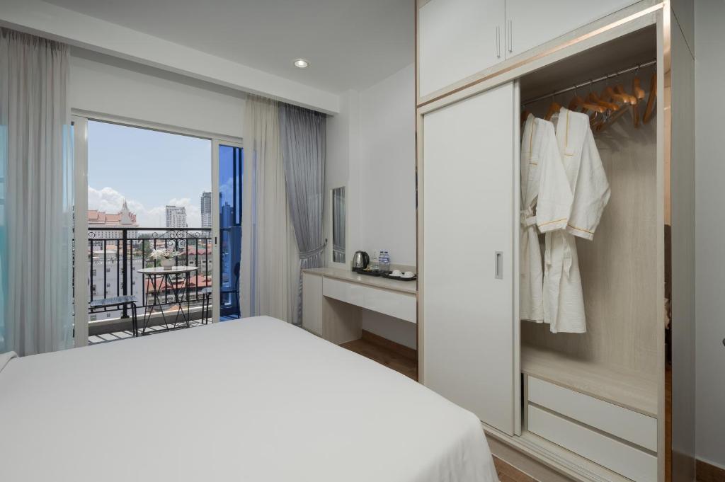 Postel nebo postele na pokoji v ubytování Amana Hotel & Residences