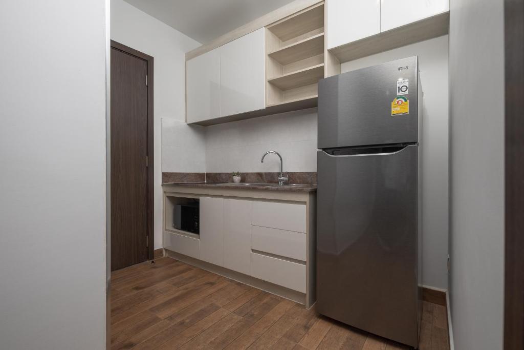Kuchyň nebo kuchyňský kout v ubytování Amana Hotel & Residences