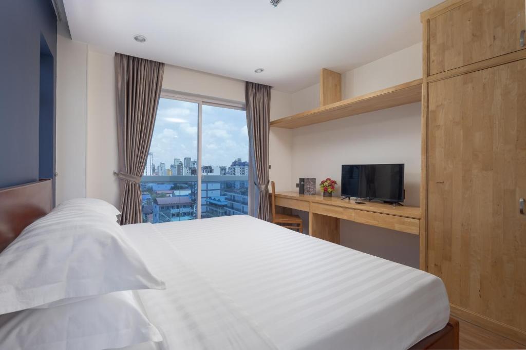 Postel nebo postele na pokoji v ubytování Amana Hotel & Residences
