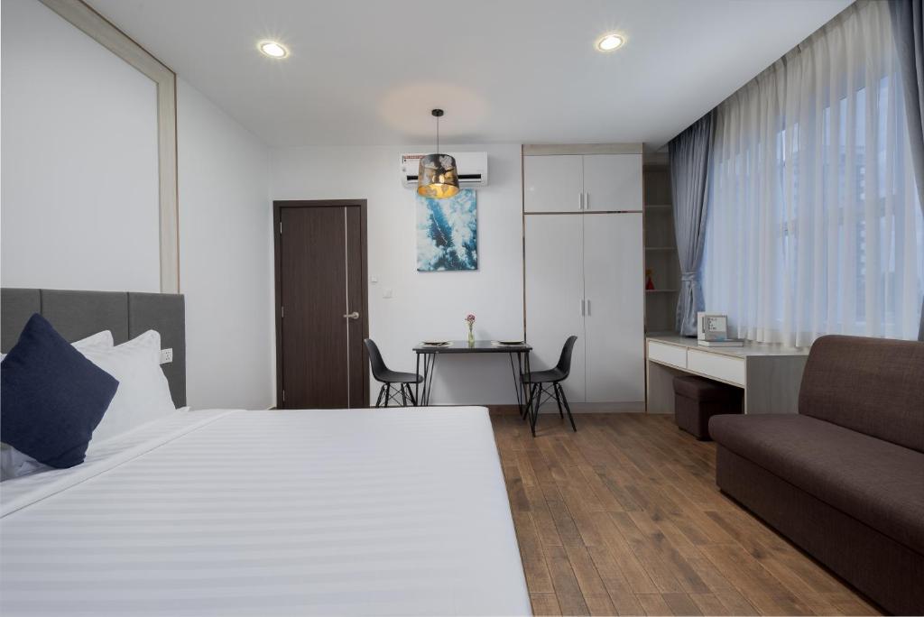 Postel nebo postele na pokoji v ubytování Amana Hotel & Residences
