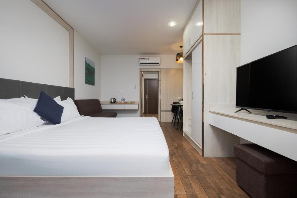 Postel nebo postele na pokoji v ubytování Amana Hotel & Residences