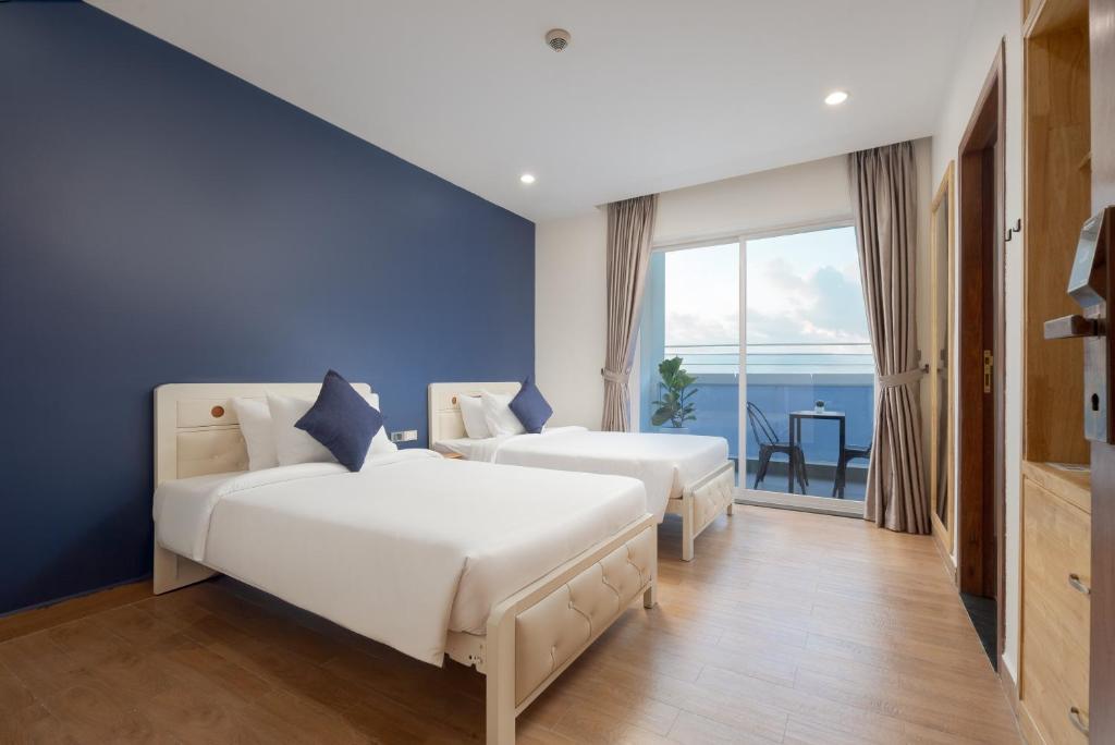 Postel nebo postele na pokoji v ubytování Amana Hotel & Residences