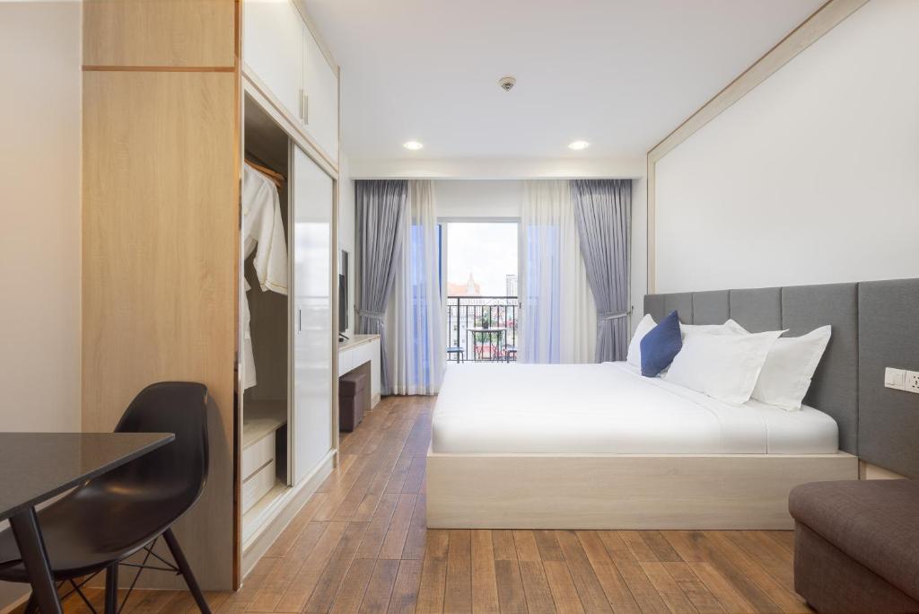 Postel nebo postele na pokoji v ubytování Amana Hotel & Residences