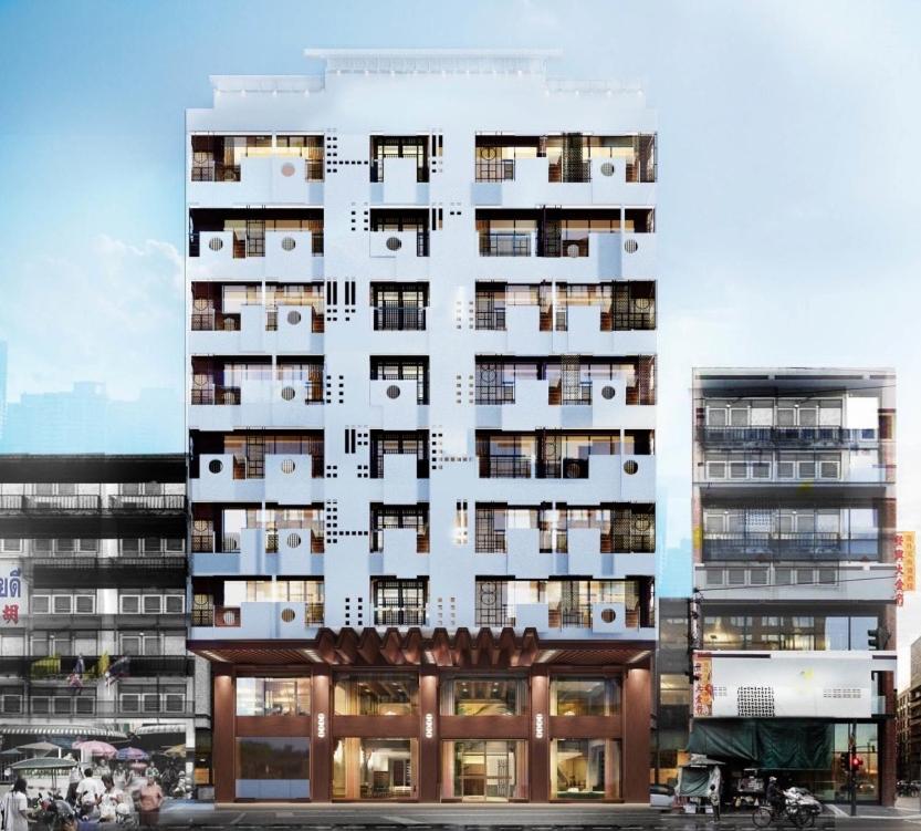 a tall white building with balconies on it at Urbanli Hatyai Hotel in Hat Yai