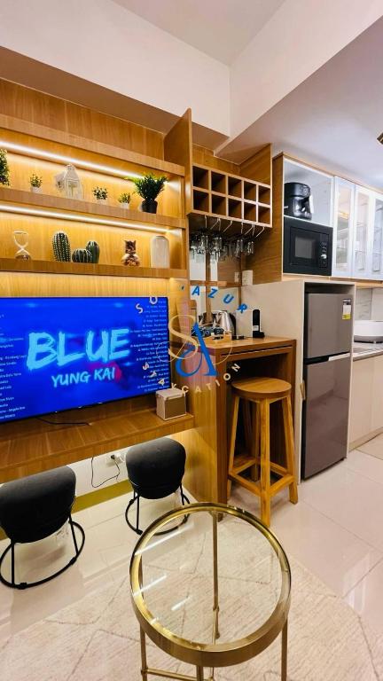 a kitchen with a blue value for sign on the wall at SolAzur Staycation SMDC South Residences Las Piñas with 100MBPS Wifi &NETFLIX &BAR STATION &CITY LIGHTS VIEW in Manila