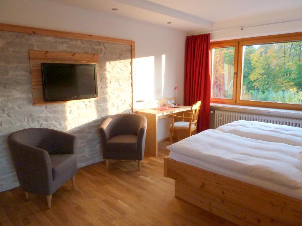 Postel nebo postele na pokoji v ubytování Hotel Gasthof Adler