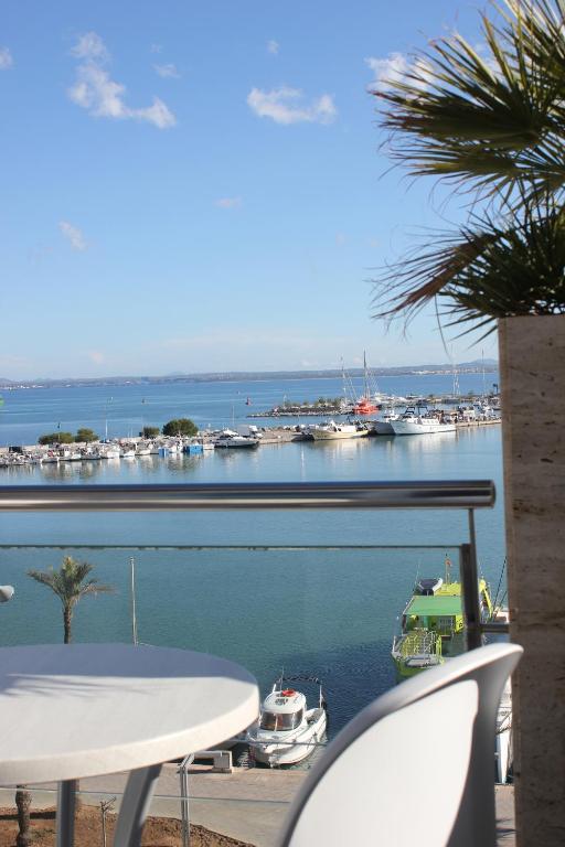 a view of a marina with boats in the water at Hostal Brisa Marina in Port d'Alcudia