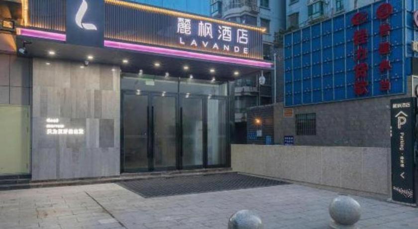 a building with a revolving door in a city at Lavande Hotels· Suizhou Wenfeng in Suizhou