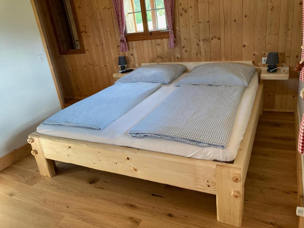 Postel nebo postele na pokoji v ubytování Ferienhütte Troadkostn
