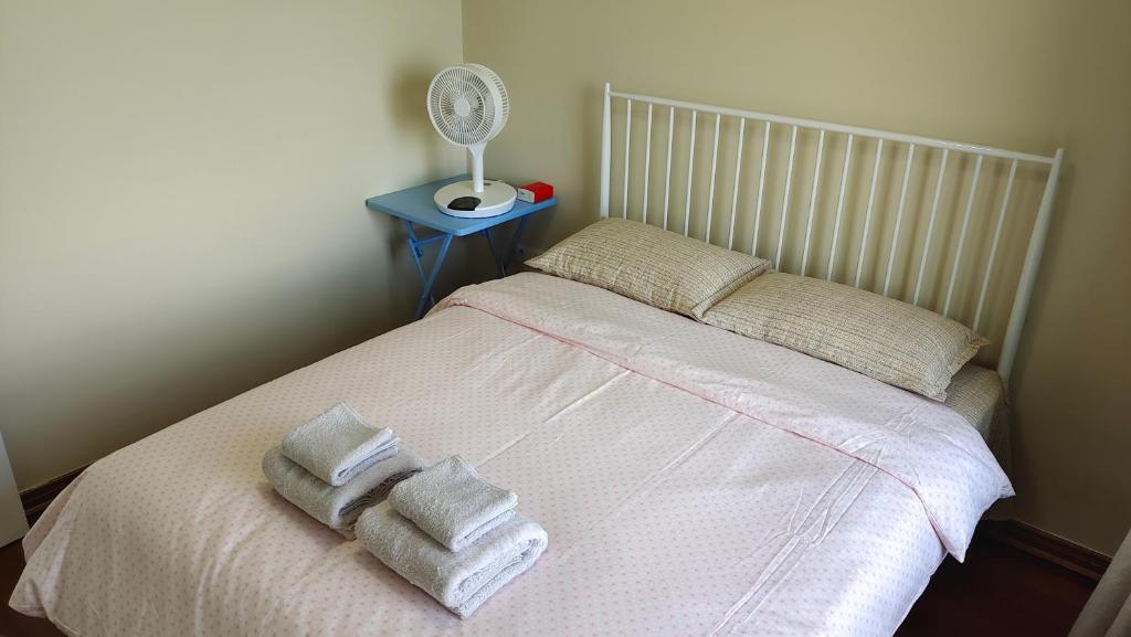 Postel nebo postele na pokoji v ubytování Yuan Apartment