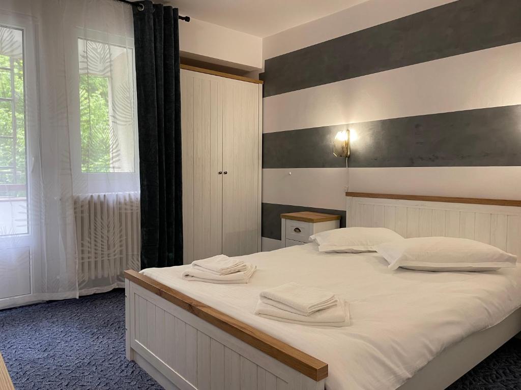 Postel nebo postele na pokoji v ubytování Hotel Hefaistos - Sovata