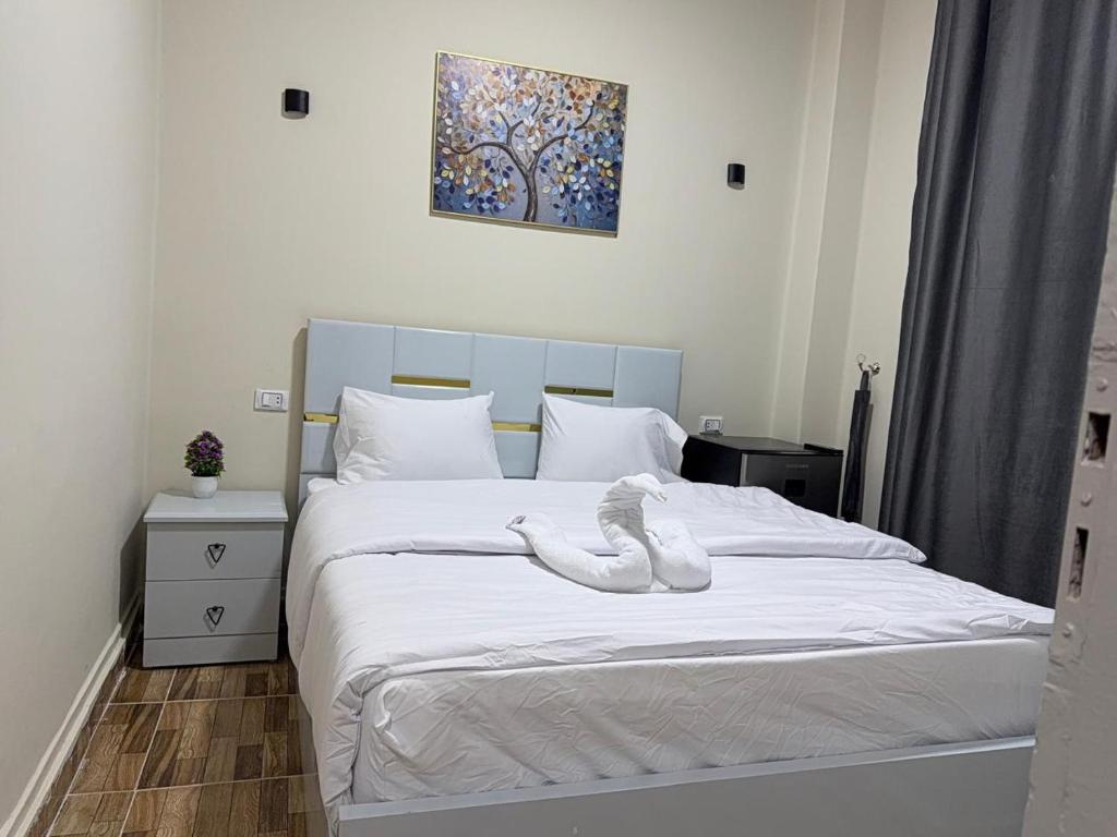 Postel nebo postele na pokoji v ubytování Sky light hotel