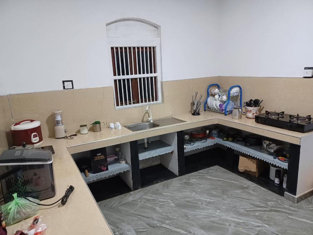 Η κουζίνα ή μικρή κουζίνα στο The Mango Villa